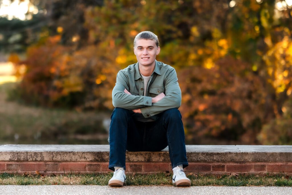 senior guy with fall backdrop
